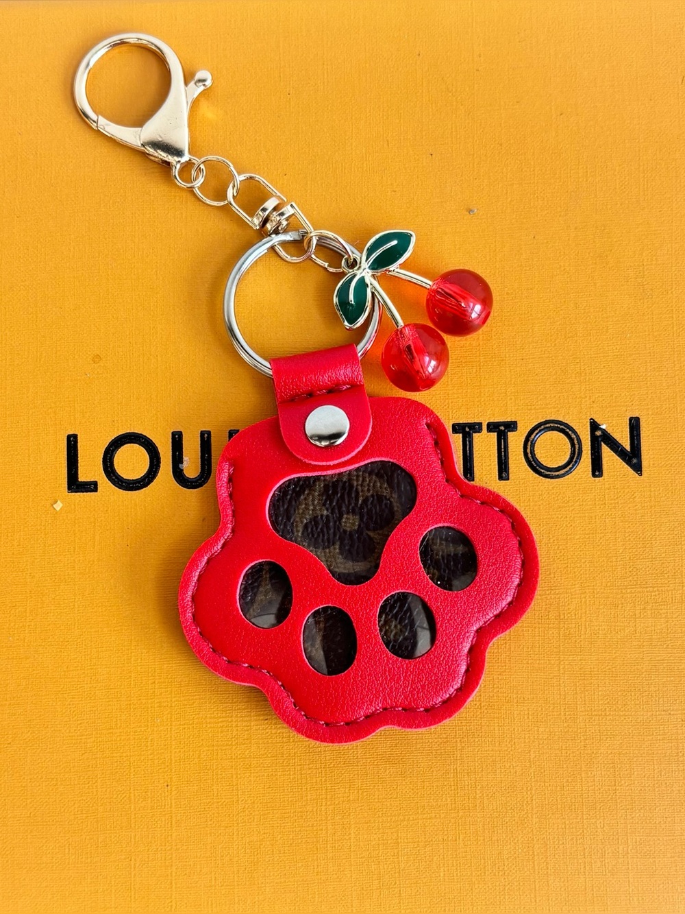 Louis Vuitton Dog Paw Print
Bag Charm, Cherries, Keychain, 4.75 in., Upcycled